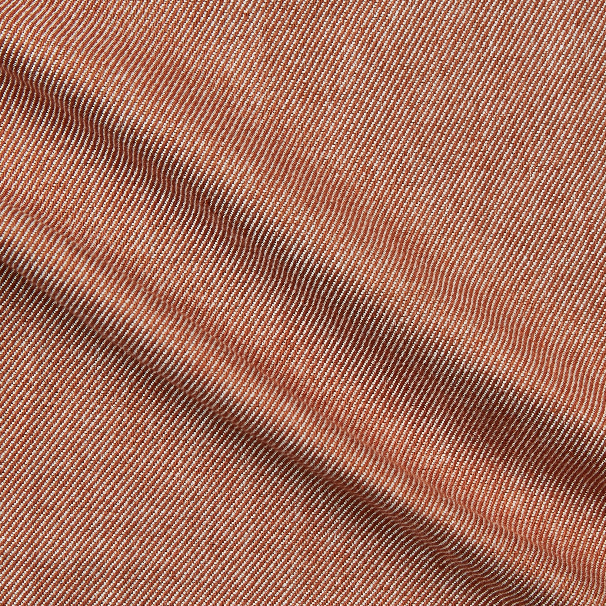 Cotton Twill displaying the rust color version of a heavy weight yarn dyed pure cotton fabric suitable for suiting