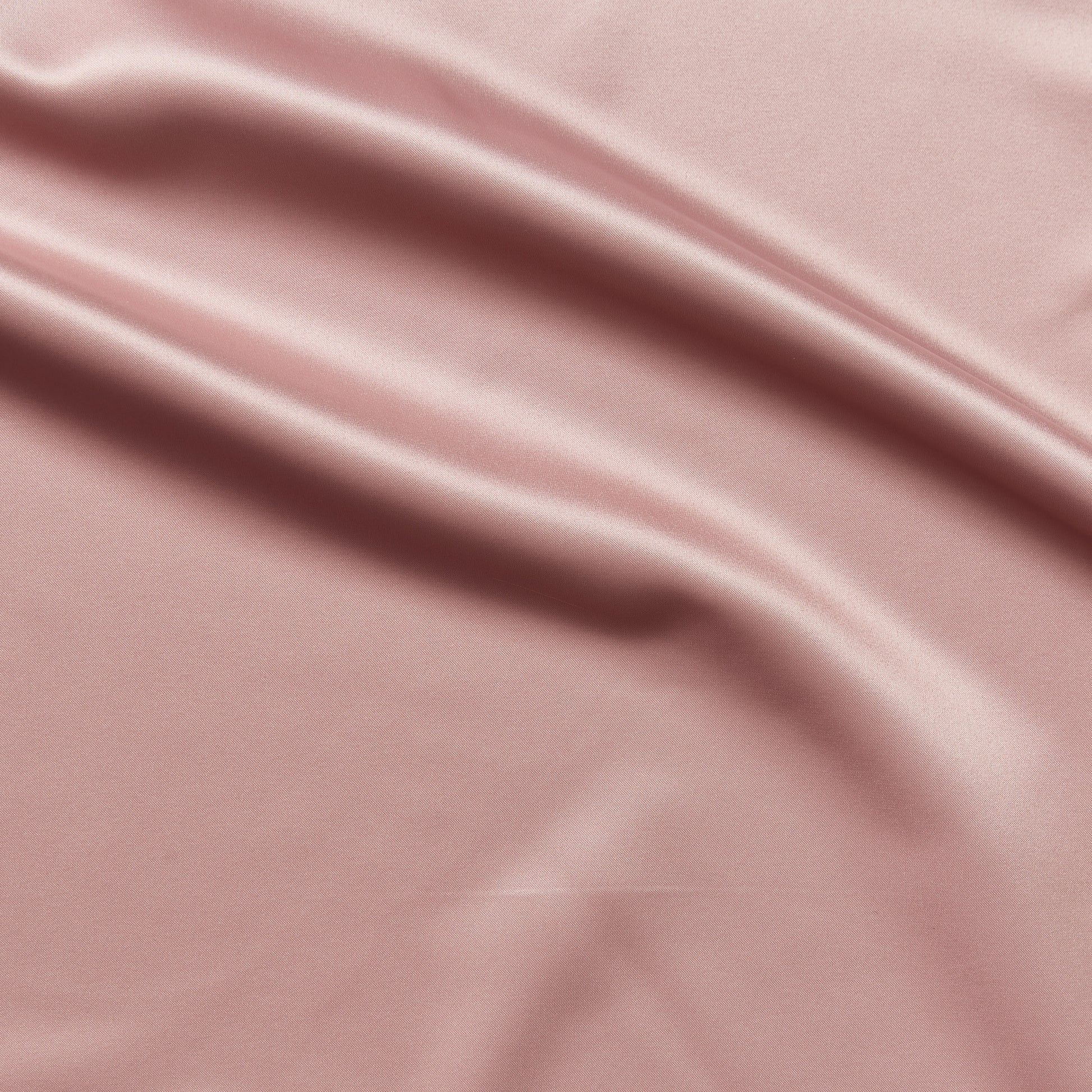 countess showing the antique color version of a crisp satin pure polyester fabric with moderate drape suitable for dresses