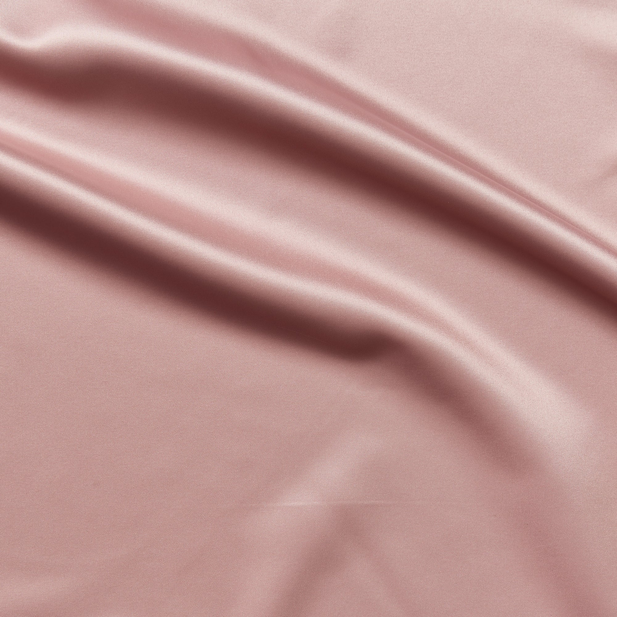 countess displaying the antique color version of a crisp satin pure polyester fabric with moderate drape suitable for dresses