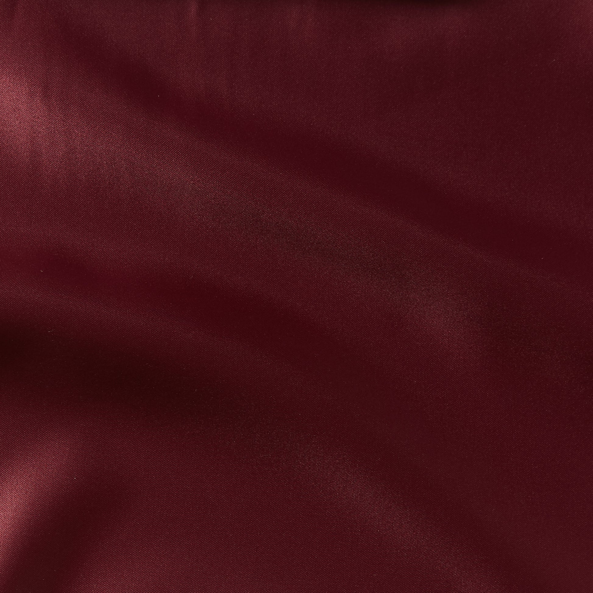 countess showing the burgundy color version of a crisp satin pure polyester fabric with moderate drape