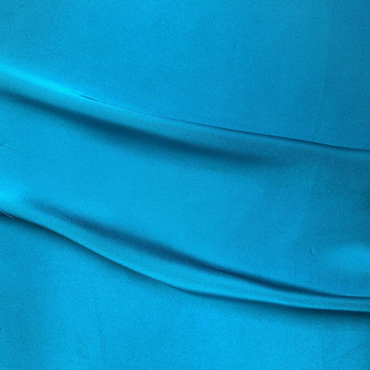 Deluxe displaying the sapphire color version of a satin chiffon silk like pure polyester with fluid drape