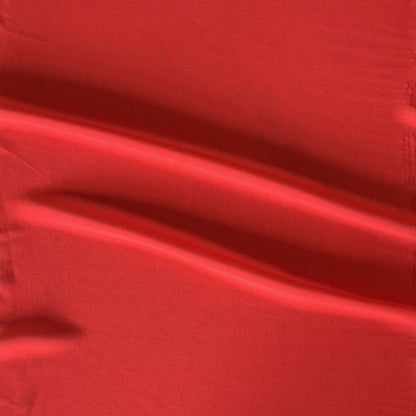 Deluxe displaying the scarlet color version of a satin chiffon silk like pure polyester with fluid drape