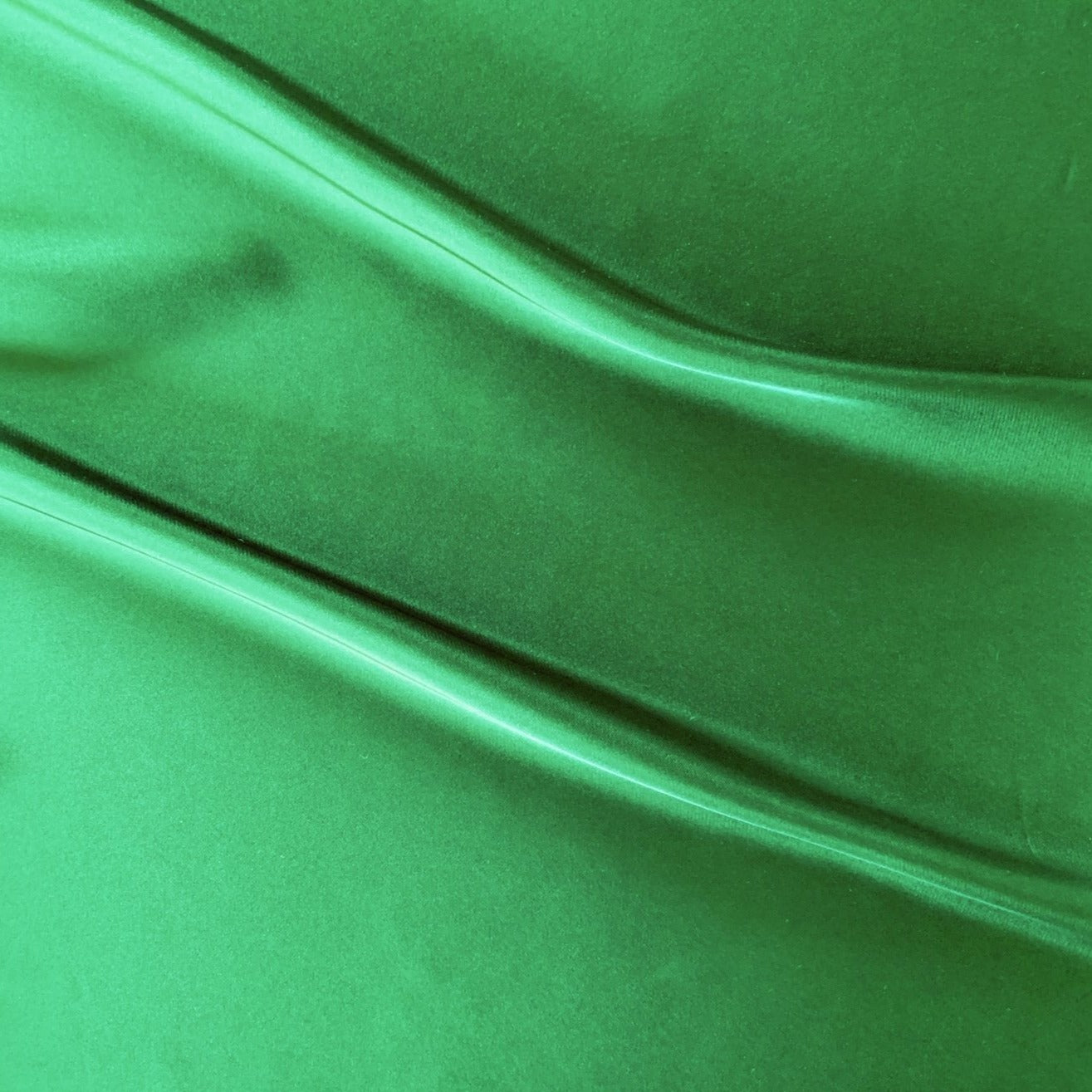 Deluxe displaying the emerald version of a color satin chiffon silk like pure polyester with fluid drape