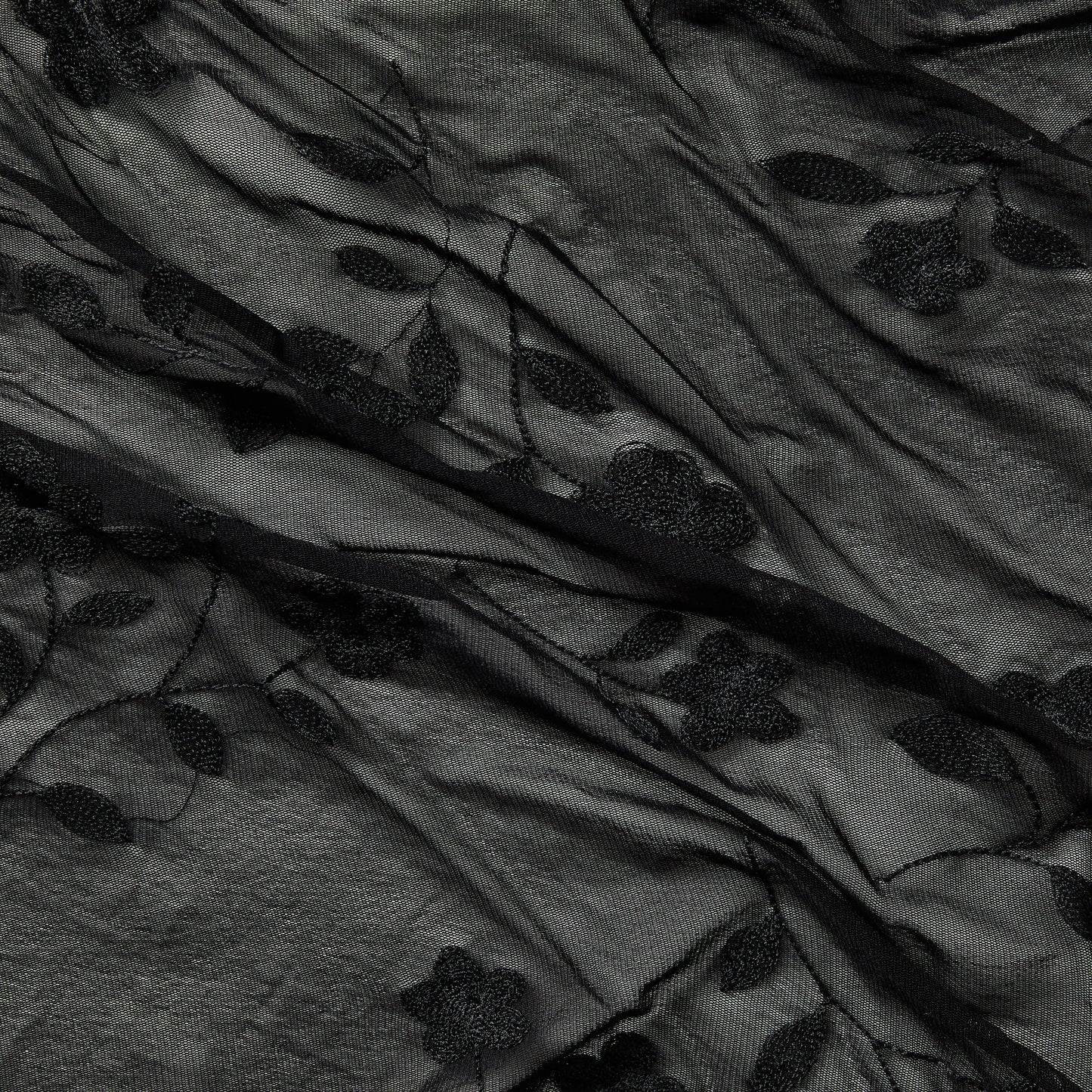 Showing destiny a black colored Rayon and Nylon Floral Embroidery on sheer black mesh 