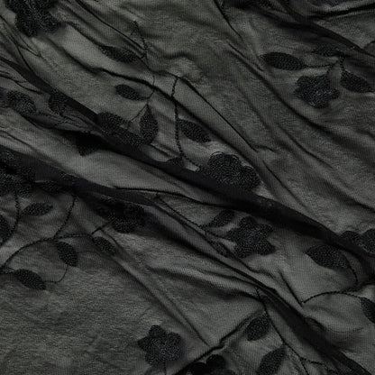 Showing destiny a black colored Rayon and Nylon Floral Embroidery on sheer black mesh 