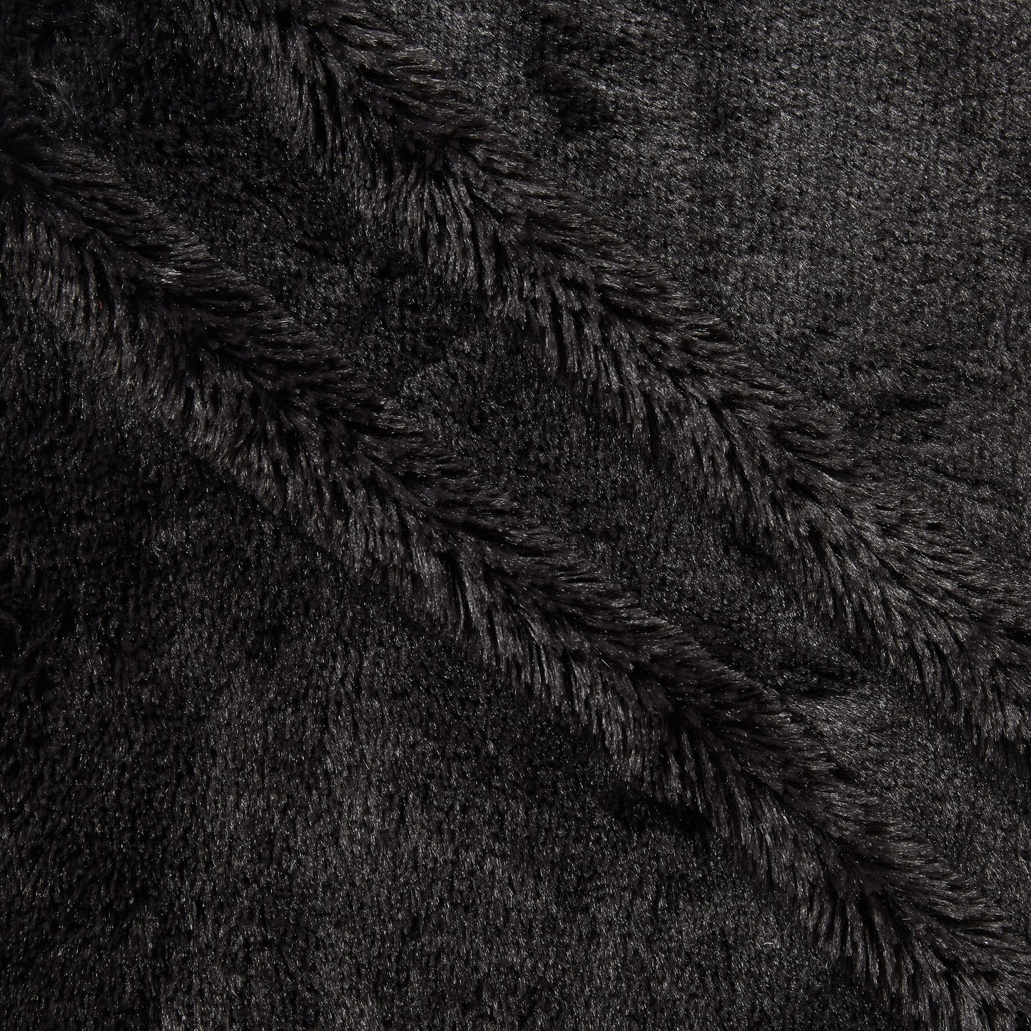 Elise Plain displaying the charcoal color version pure polyester Soft faux fur closeup