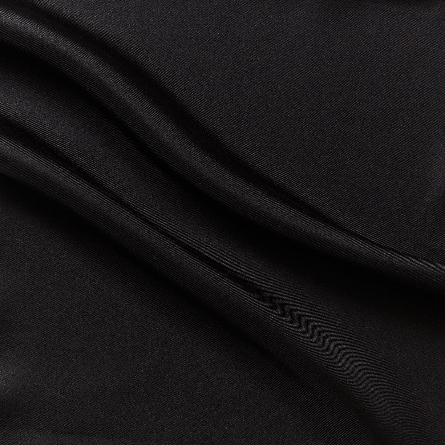 Eternity displaying the black color version of a heavy weight pure mulberry silk satin with fluid drape