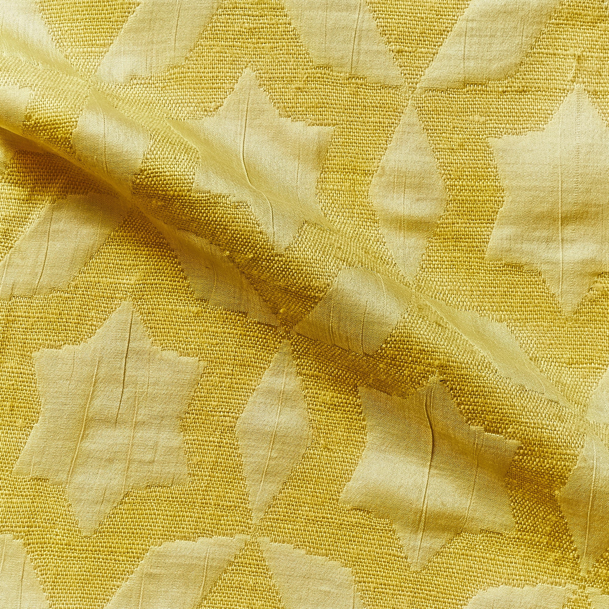 fame displaying the  gold colored Raw pure silk with geometric star designed jacquard with moderate drape