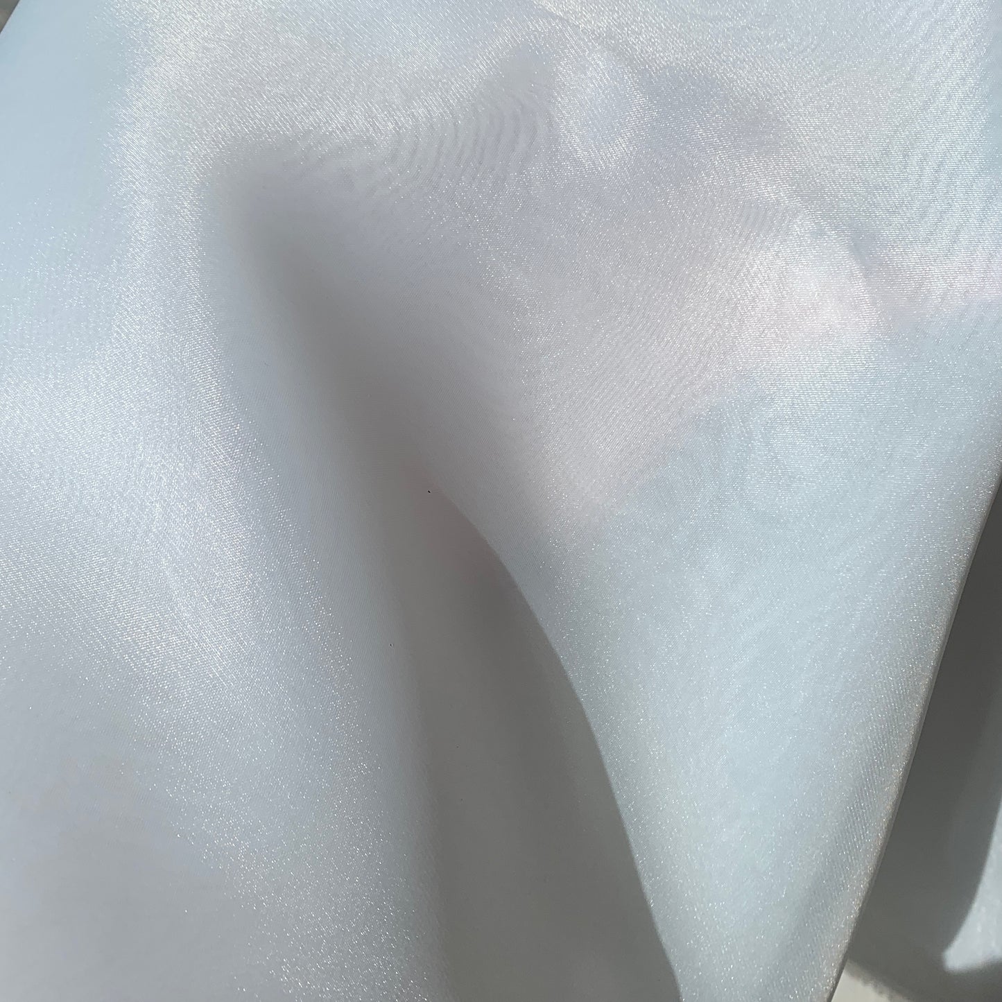 Displaying Gazar Satin Organza a ivory colored lustrous poly organza with a soft hand-feel