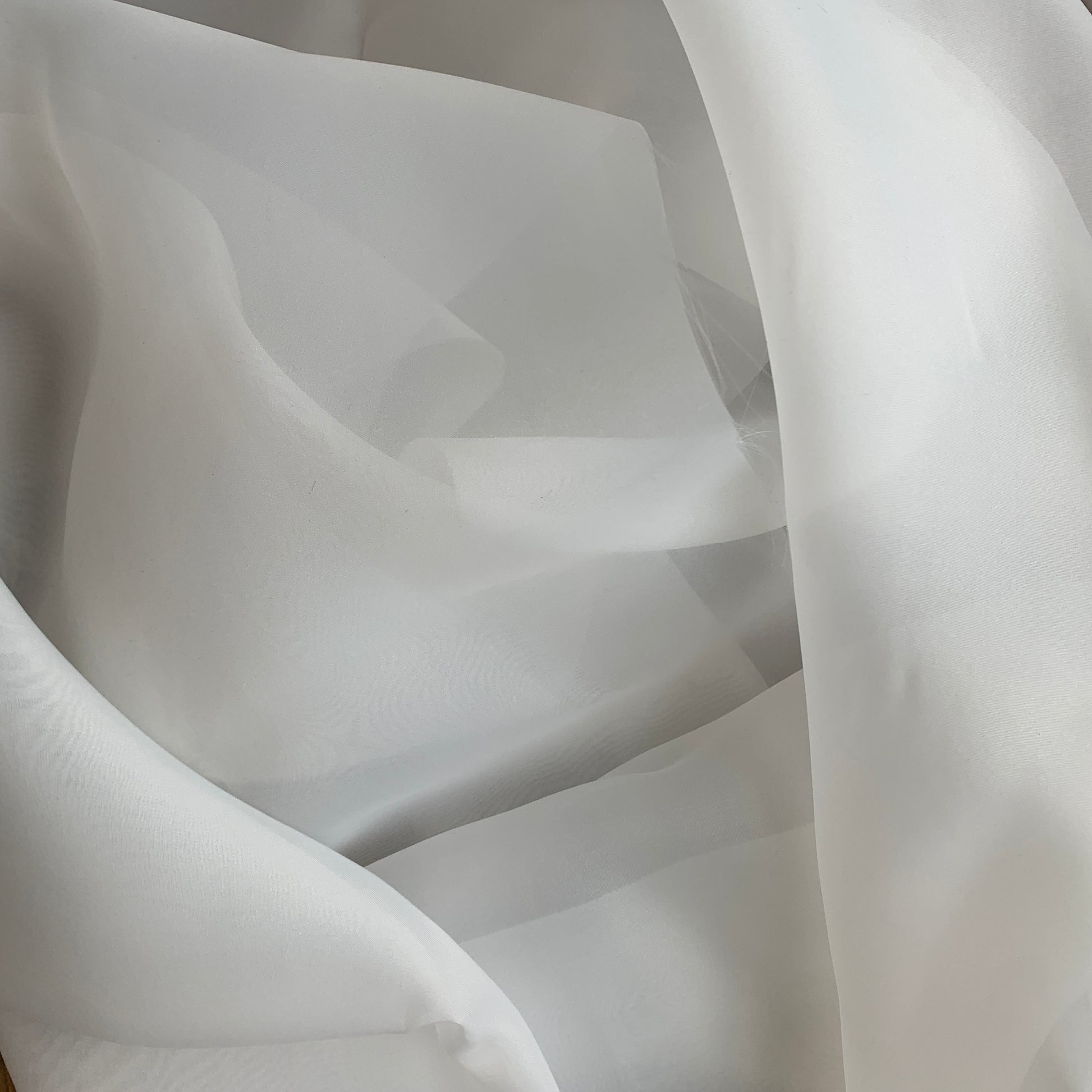 Displaying Gazar Satin Organza a ivory colored lustrous poly organza with a soft hand-feel