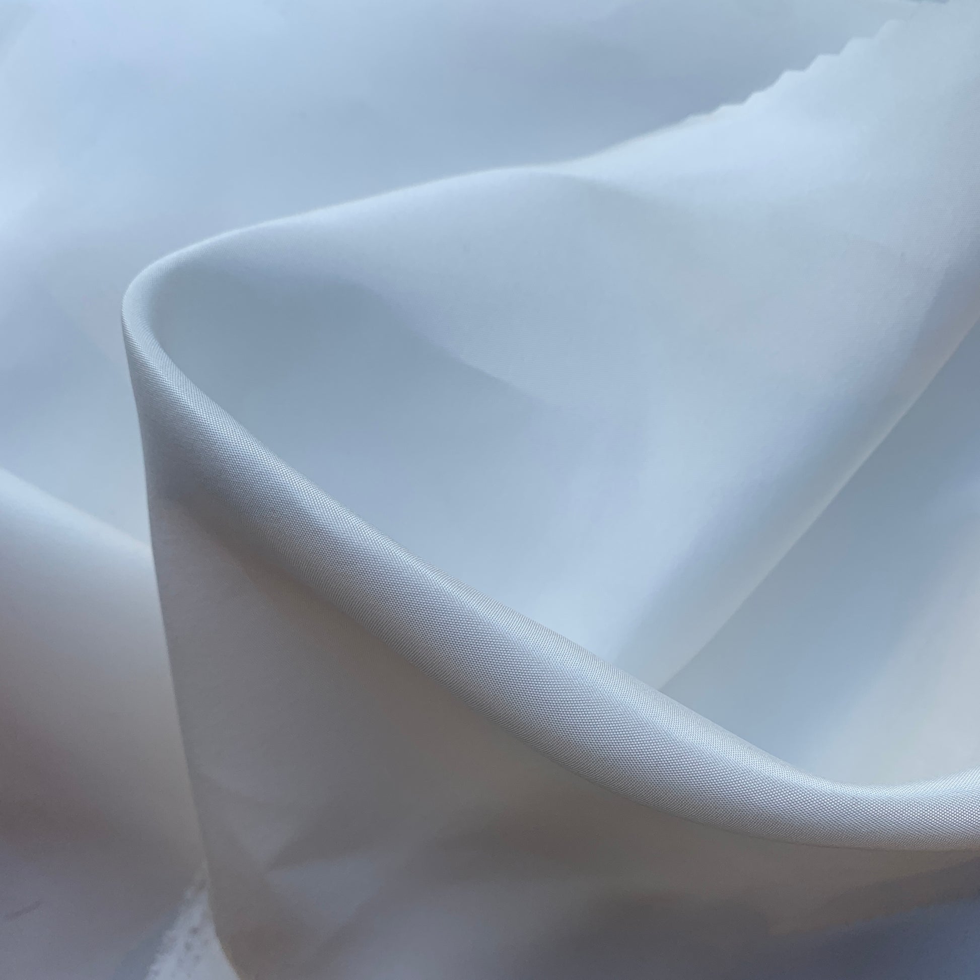 silk taffeta showing the natural color version of a smooth crisp pure silk with good drape with good drape