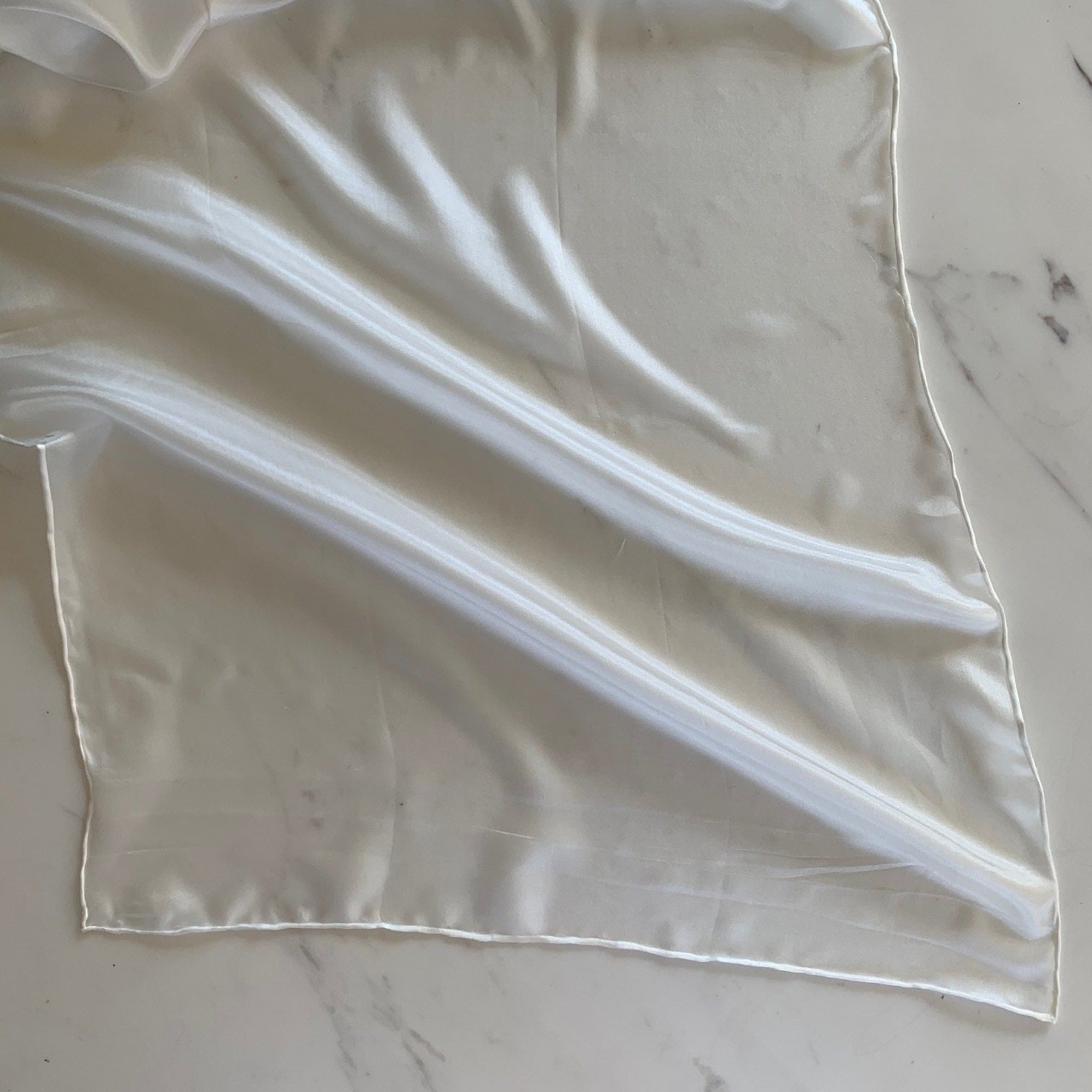 Presenting the JAP SILK scarf in natural color featuring a soft light weight pure silk scarf 28x160cm with fluid drape