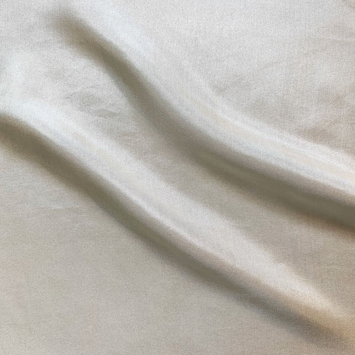 jap silk demonstrating the Natural color version of a soft light weight mulberry pure silk with fluid drape and natural sheen