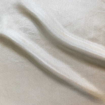 jap silk demonstrating the Natural color version of a soft light weight mulberry pure silk with fluid drape and natural sheen