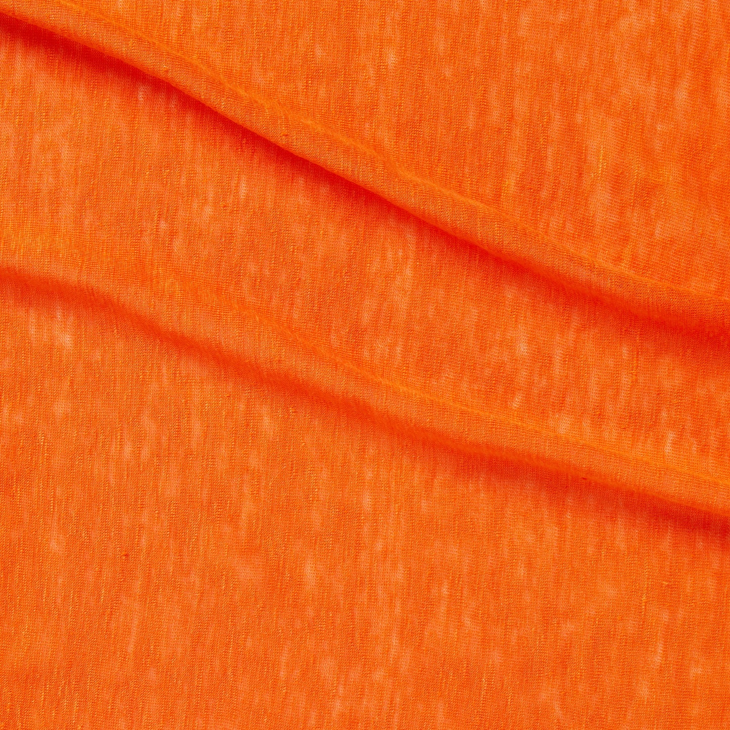 linen knit displaying the orange color version of a pure lightweight linen with fluid drape