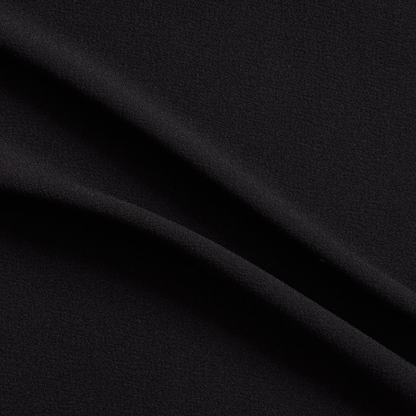 London Crepe presenting the black color version with 2 way stretch knit polyester with spandex