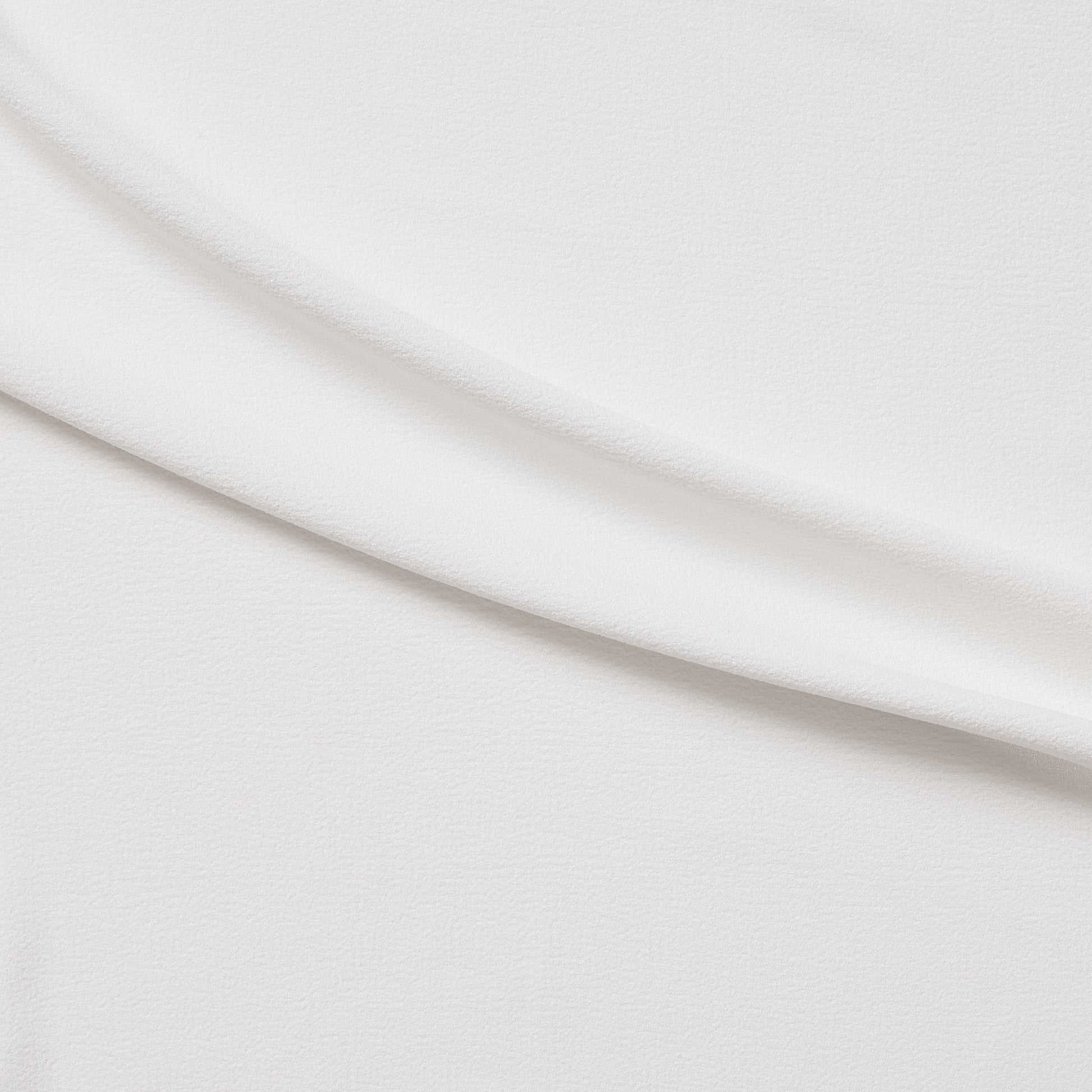 London Crepe presenting the ivory color version with 2 way stretch knit polyester with spandex