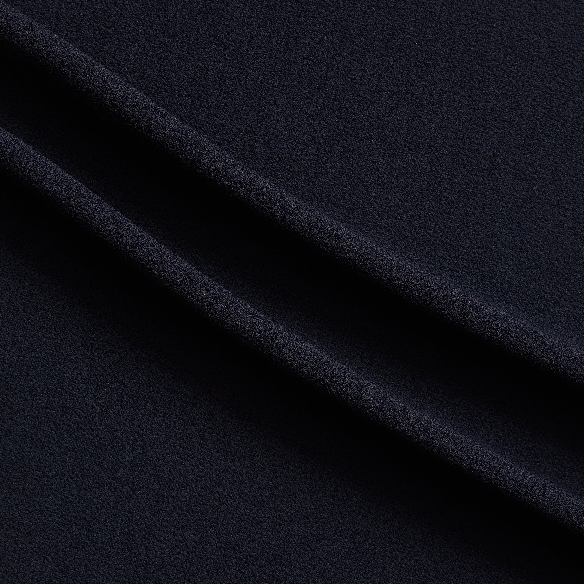 London Crepe presenting the navy color version with 2 way stretch knit polyester with spandex