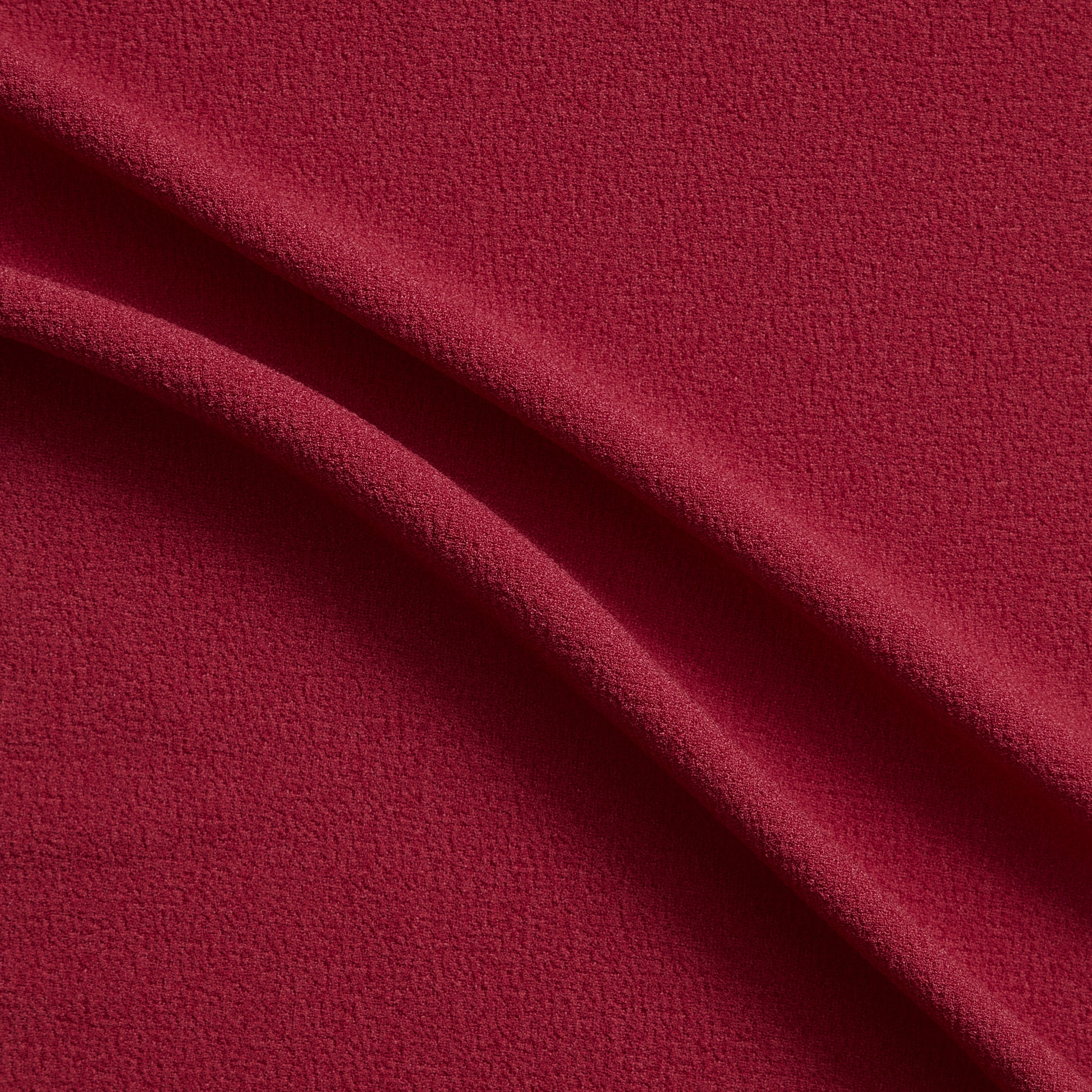 London Crepe presenting the red color version with 2 way stretch knit polyester with spandex