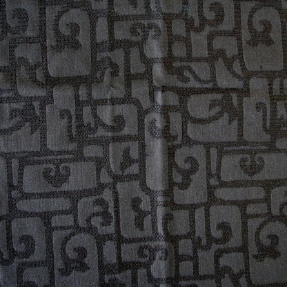 luxor displaying the black color version of a heavy weight pure silk brocade with abstract Egyptian styled pattern