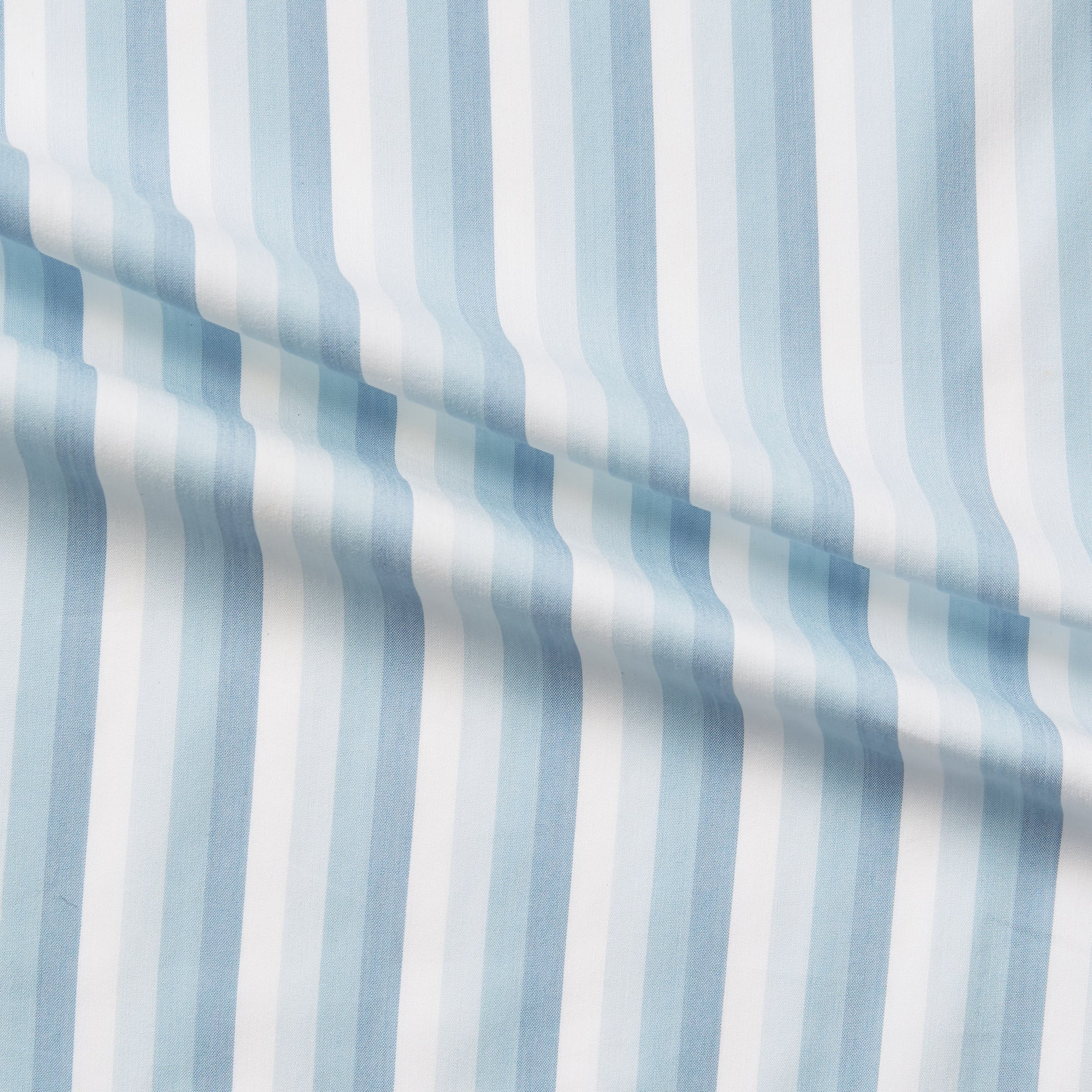 marconi displaying blue colored shades of a multi toned striped soft light weight combed cotton and polyester blend