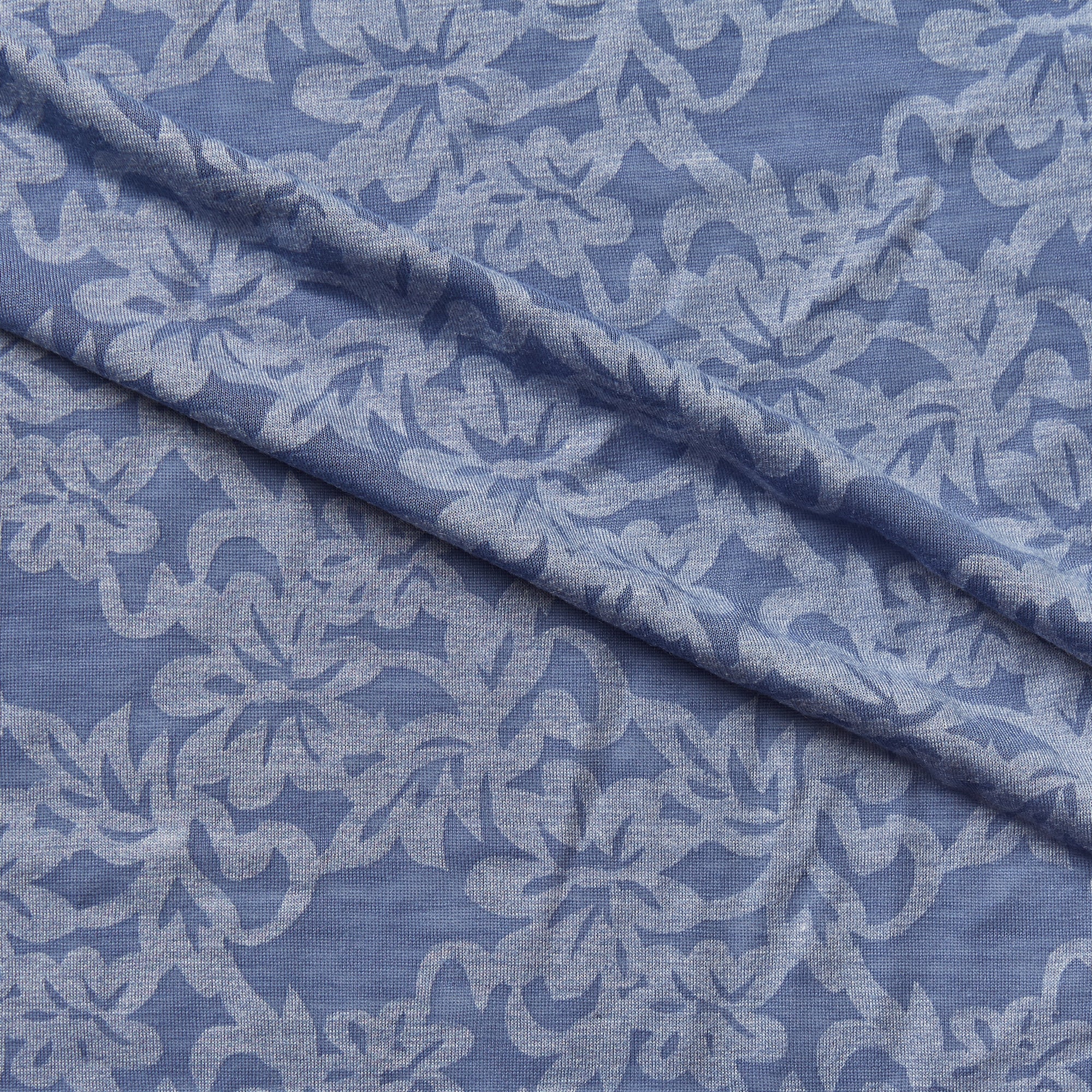 maui  illustrating the blue color version of a floral burnout print on polyester and rayon stretch jersey knit