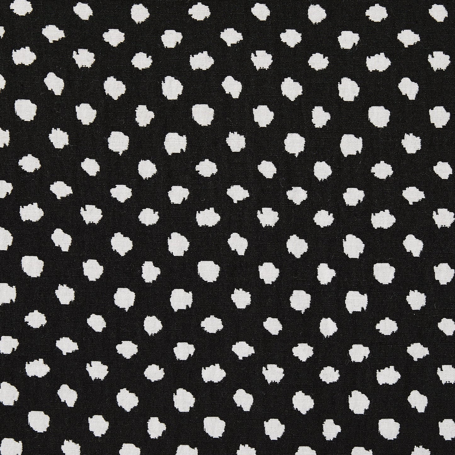 meteor featuring a black and white stretch, reversible, cotton poly with spandex blend featuring a dobby weave with whiite and black spotty blotches closeup