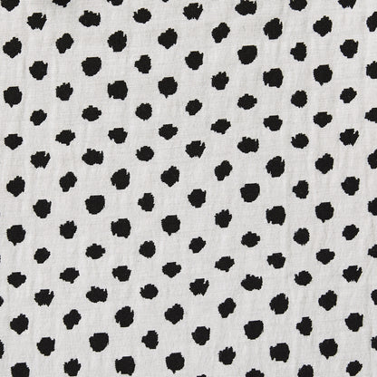 meteor featuring the reverse stretchable, reversible, cotton poly with spandex blend featuring a dobby weave with spotty blotches showing reverse side of black on white