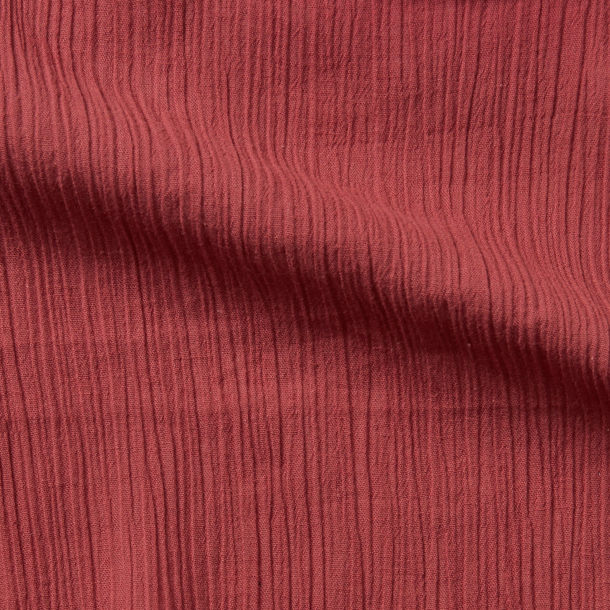 muslin displaying the garnet color version of a pure  breathable soft and natural  cotton muslin with yoryu crinkle textured face