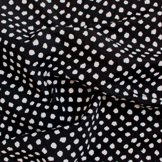meteor featuring a stretchable, reversible, cotton and polyester with spandex blend featuring a dobby weave with white on black spotty blotches and good drape