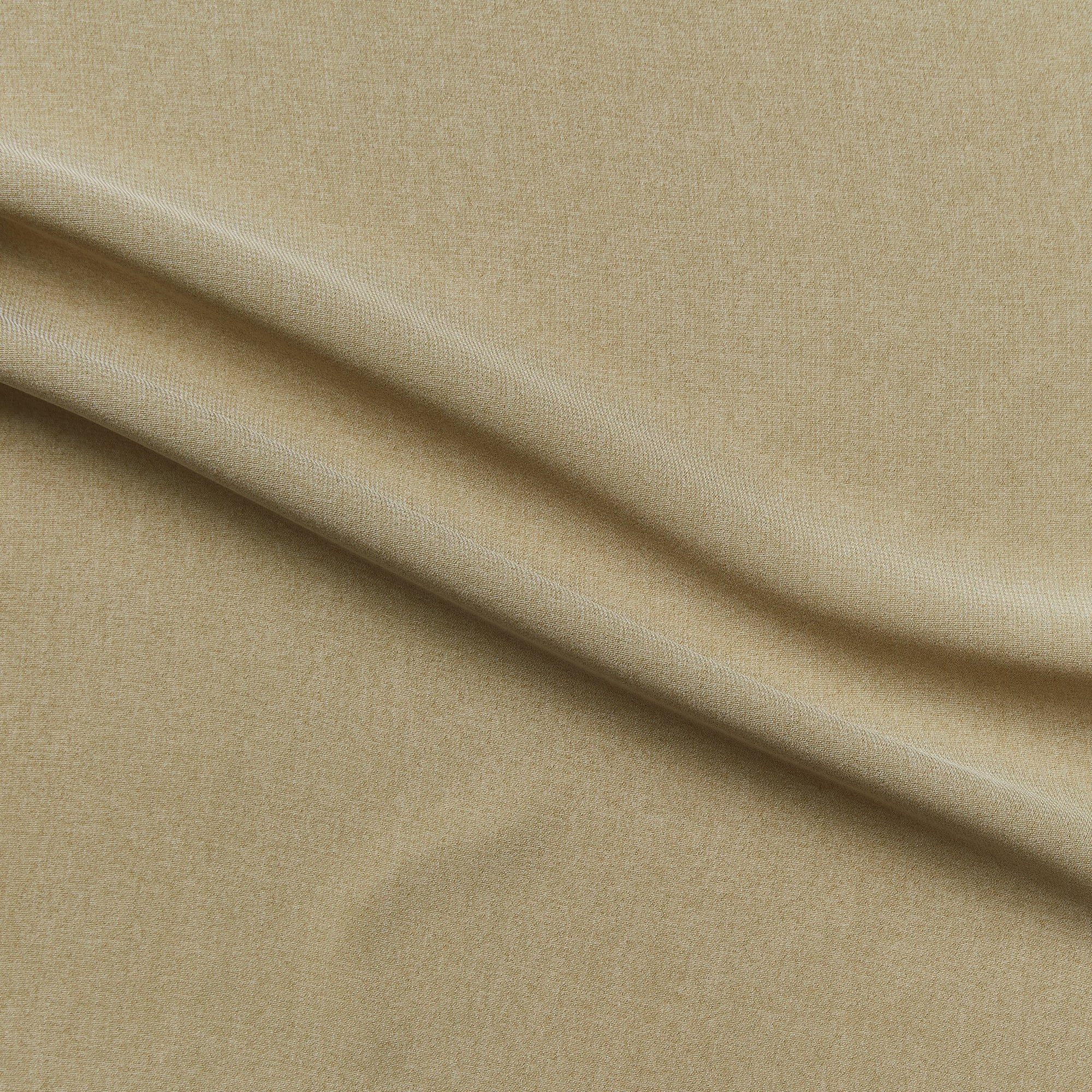 nicola displaying the taupe colored version of a soft semi sheer solid woven pure polyester with fluid drape