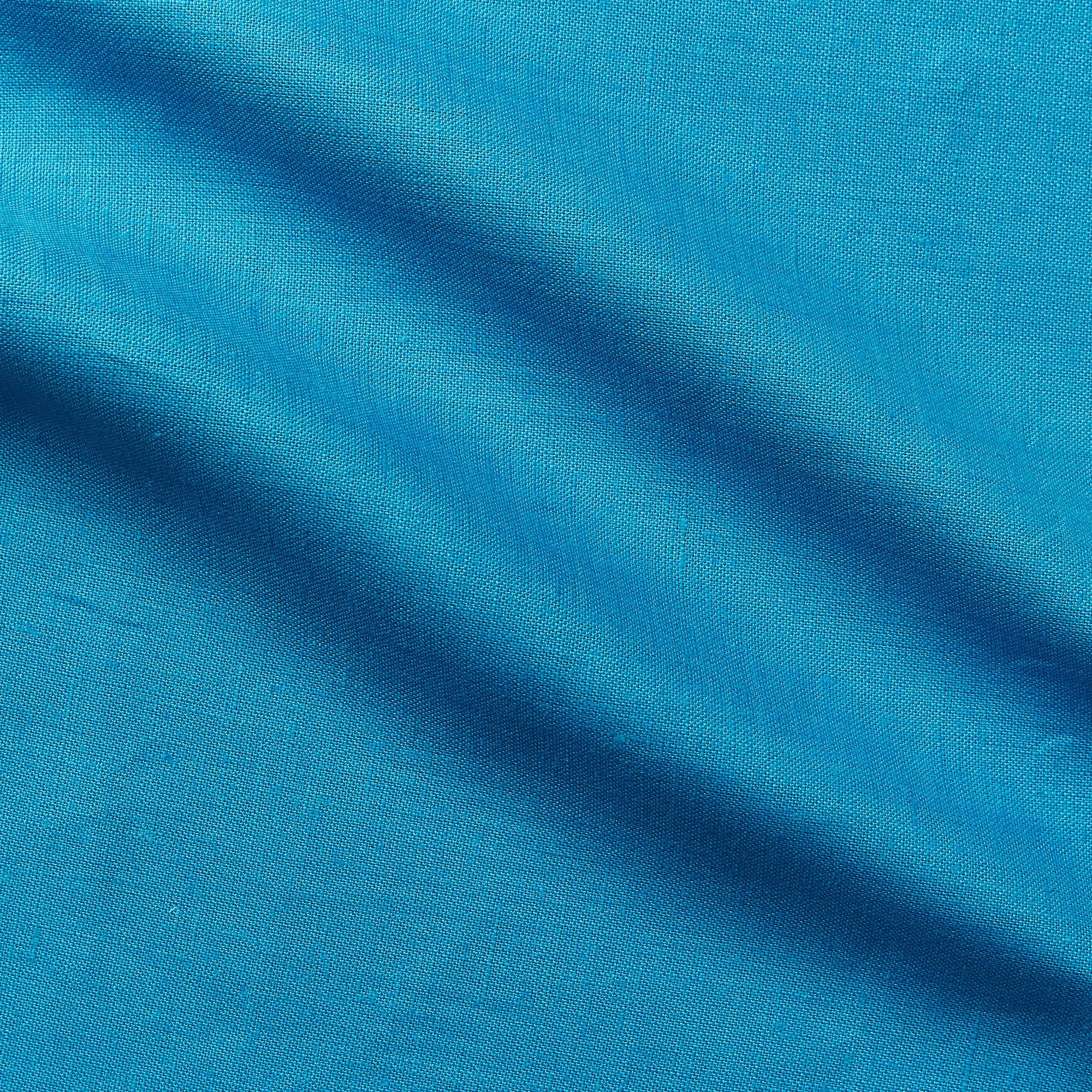rave on displaying the electric blue color version of a Medium weight breathable pure linen with moderate drape