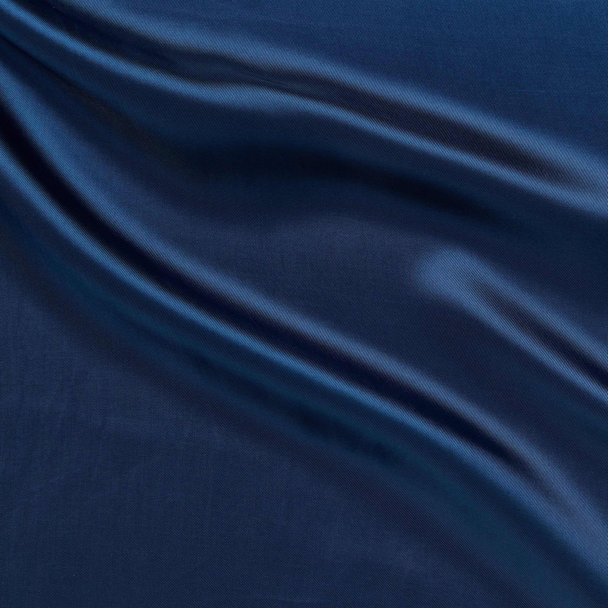 saga displaying the cobalt color version of a pure rayon Fine twill satin with fluid drape