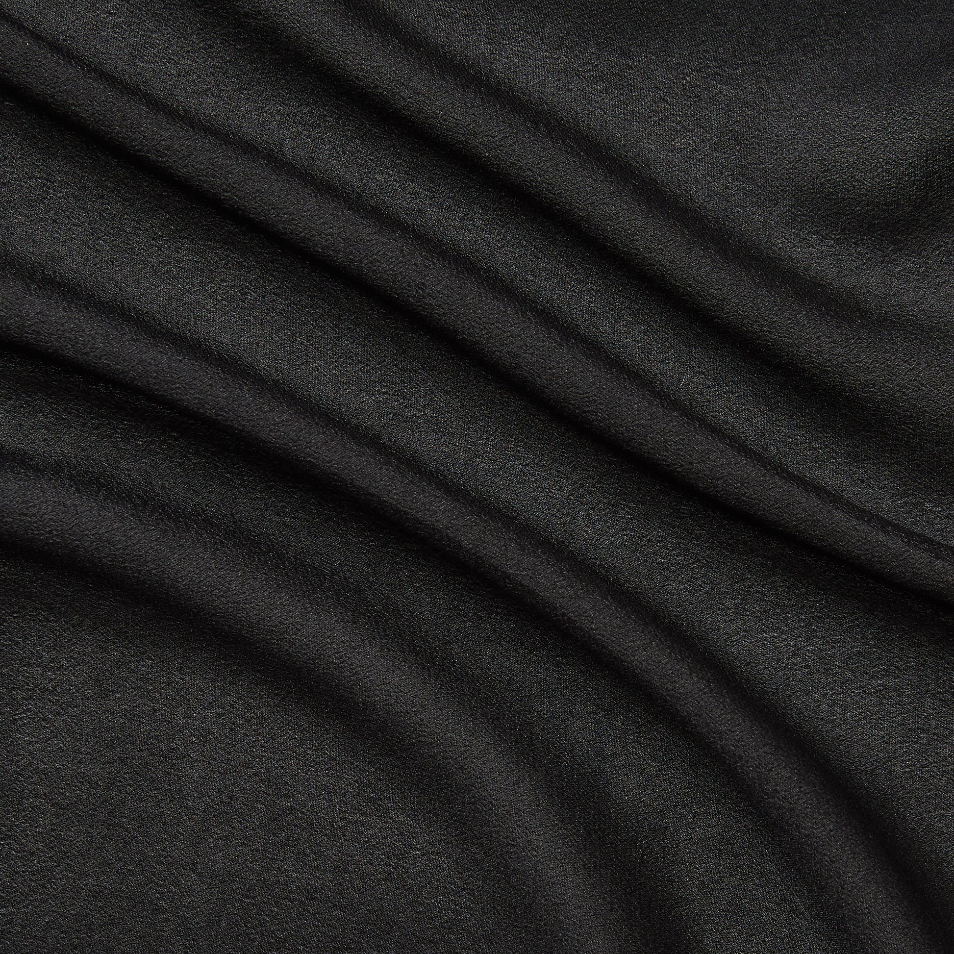 Featuring shimmer a black colored fabric with metallic glitter print on Semi-sheer, soft pure silk georgette featuring good drape