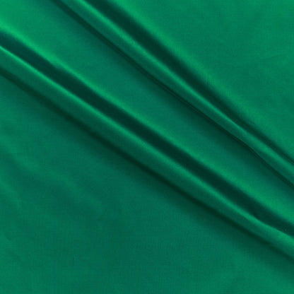 silk taffeta showing the emerald green color version of a smooth crisp pure silk with good drape