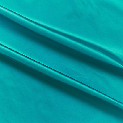 silk taffeta showing the turquoise color version of a smooth crisp pure silk with good drape