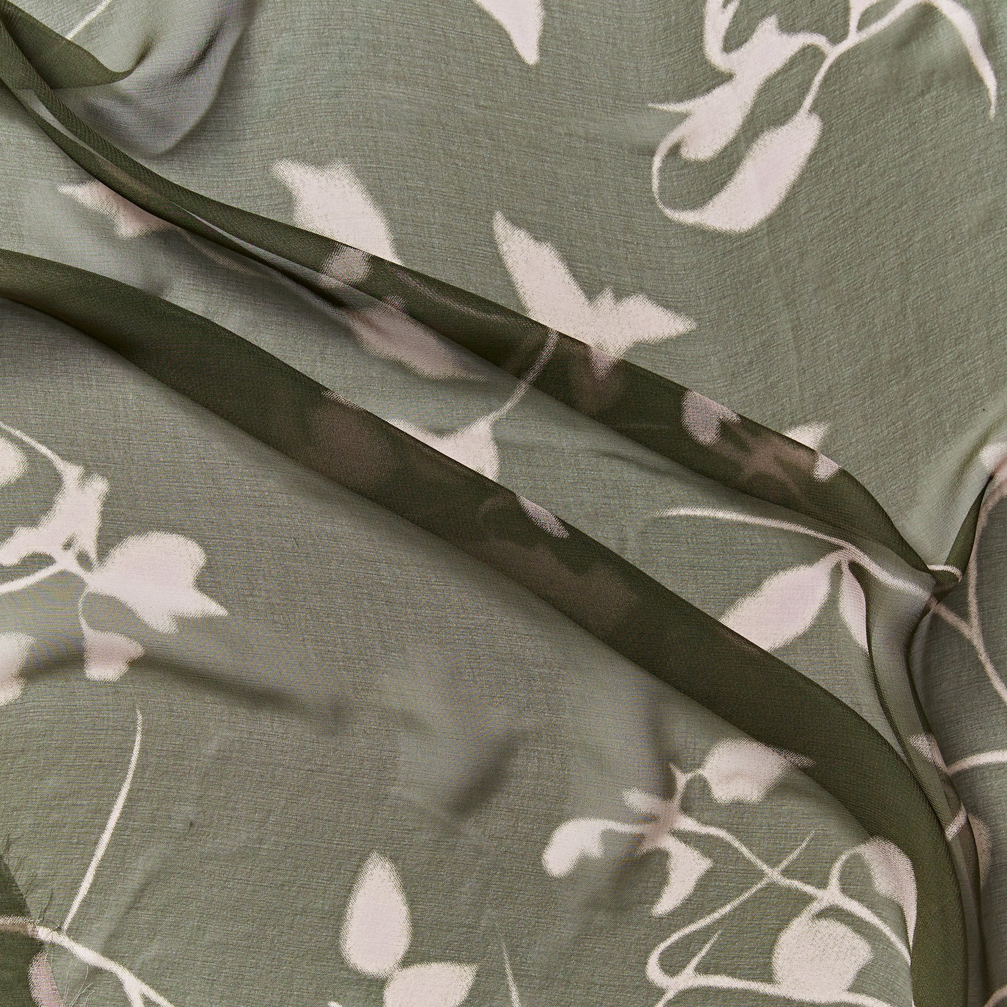 sublime illustrating the khaki  floral print on khaki color version of a sheer pure silk georgette with fluid drape