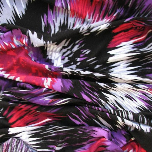 smash displaying an abstract purple colored shades digital print on stretch jersey knit rayon with spandex