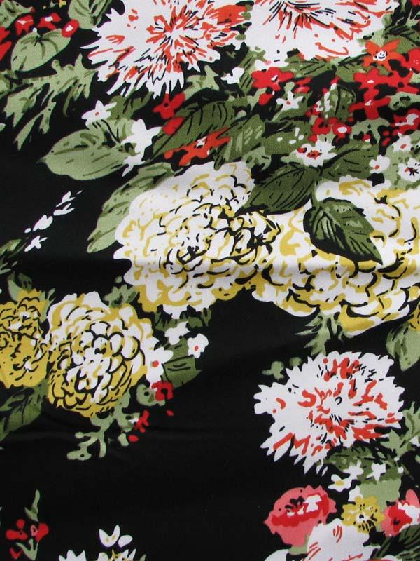 Tess exhibiting a a painterly Floral Print Stretch Cotton Blend with spandex closeup