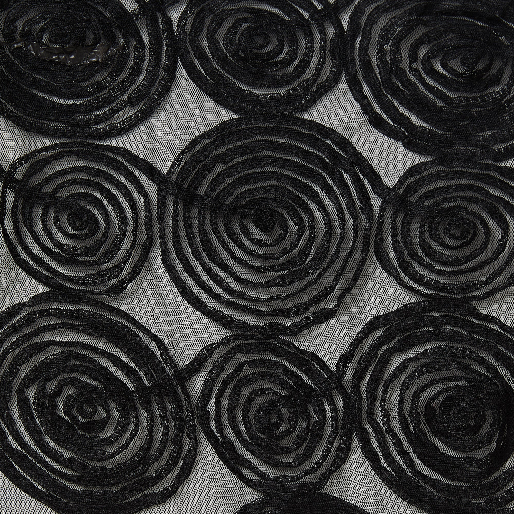 verona displaying the black color version with Spiral Circular polyester and rayon ribbon embroidery on sheer black mesh base