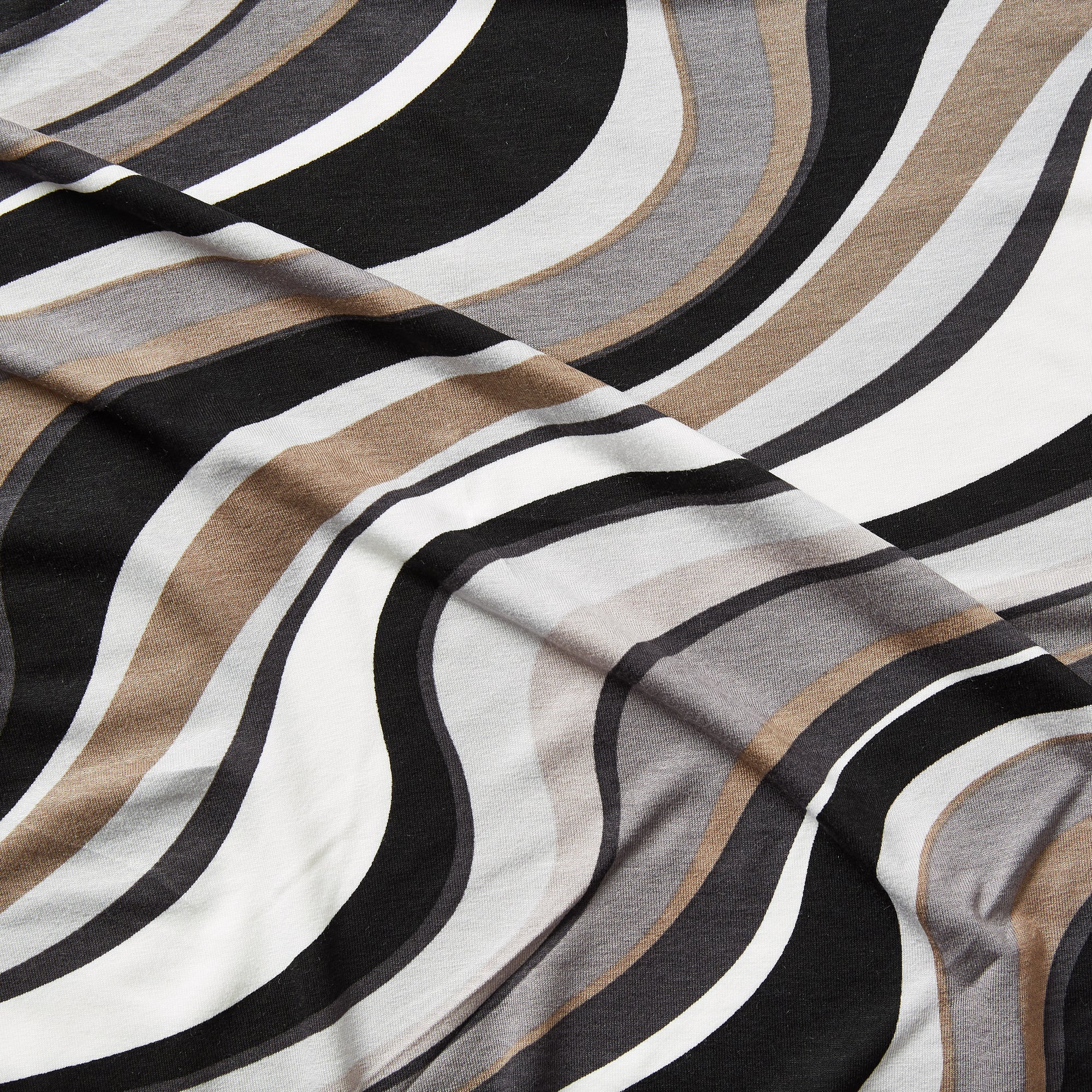 vortex displaying the coffee color version of a stretch soft jersey knit with wavy digital print rayon with spandex for figure hugging