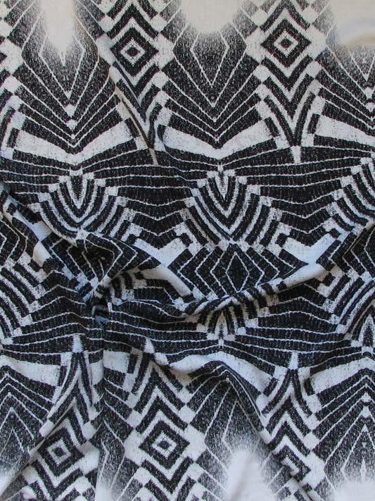 Showing warrior exhibiting a black print on silk and viscose blend with warp print