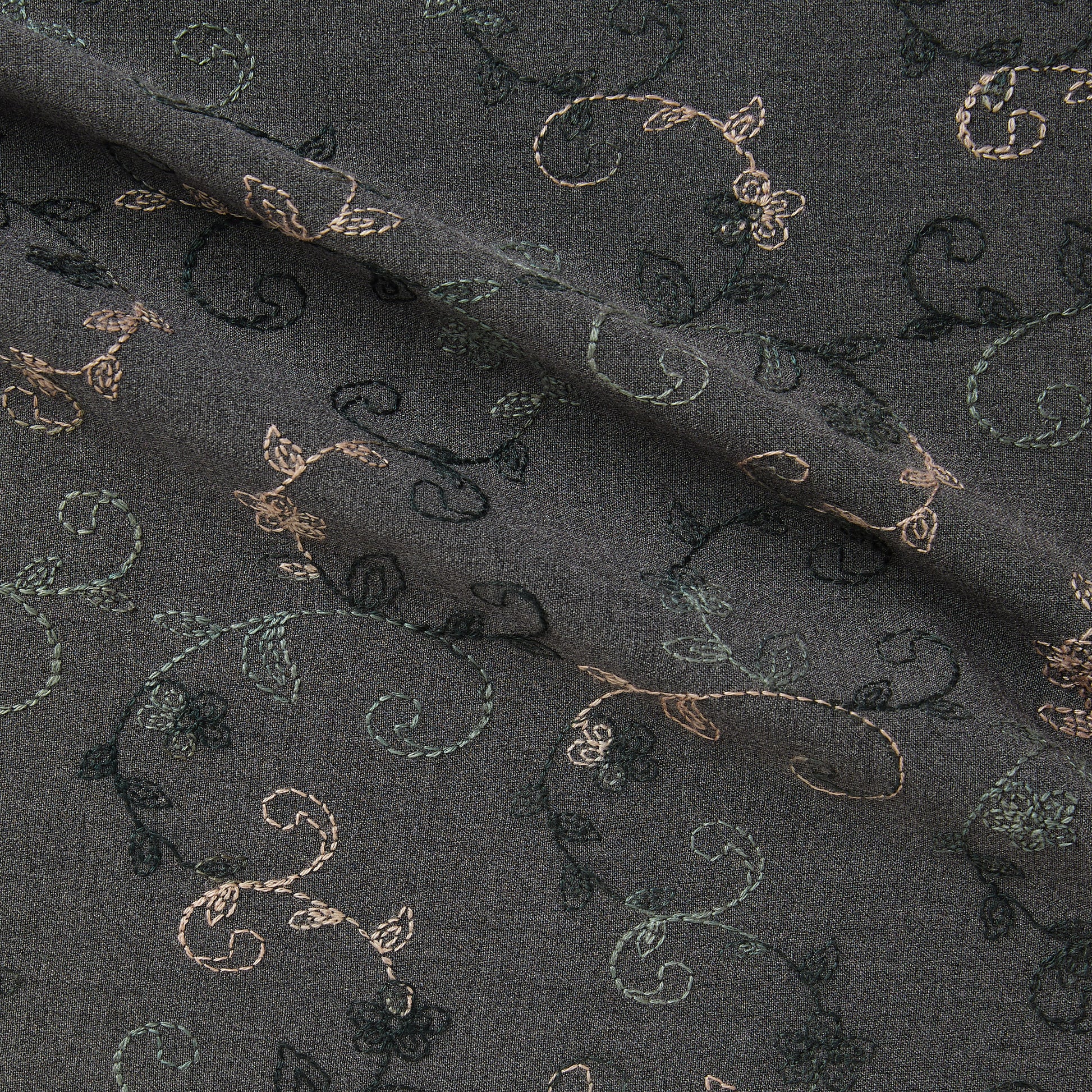 Showing zara a smooth stretch polyester and rayon with spandex  with delicate floral embroidery on charcoal grey colored background