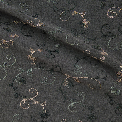 Showing zara a smooth stretch polyester and rayon with spandex  with delicate floral embroidery on charcoal grey colored background