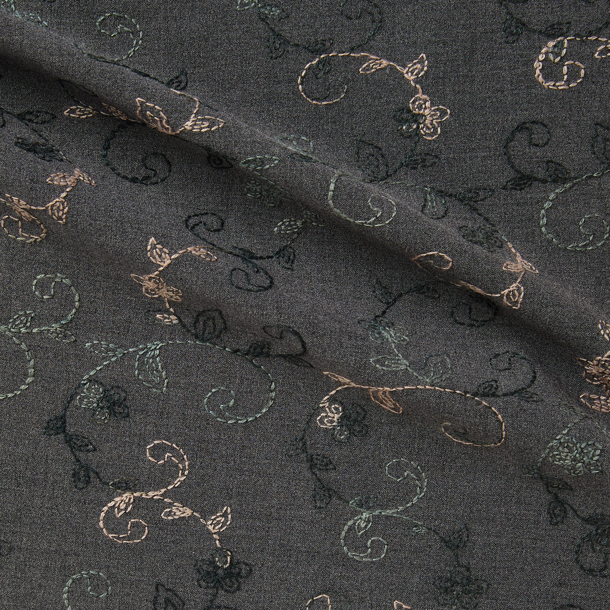 Illustrating zara a smooth stretch polyester and rayon with spandex  with delicate floral embroidery on charcoal grey colored background