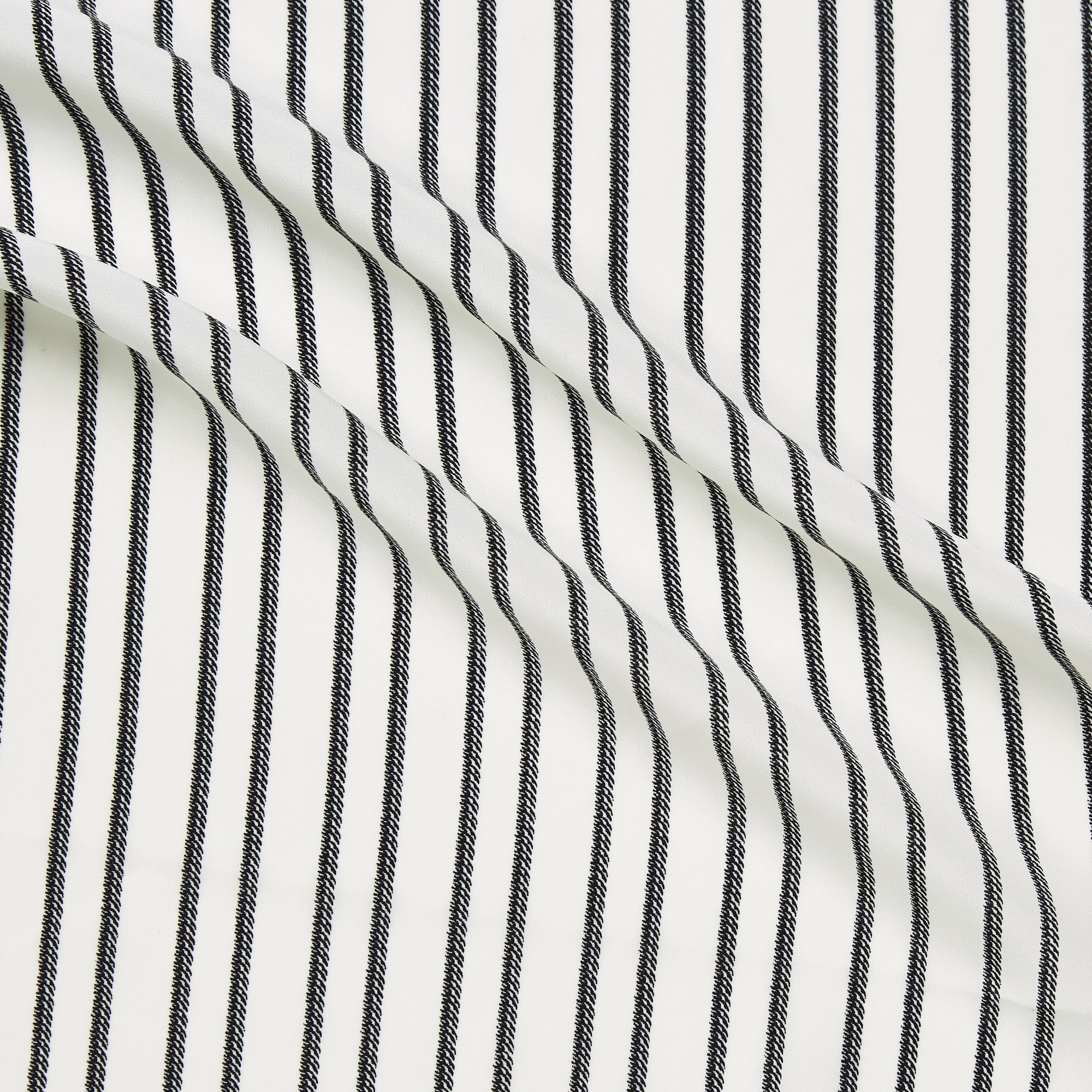 zip illustrating a white and black colored pure polyester striped rope print with slight sheen and fluid drape